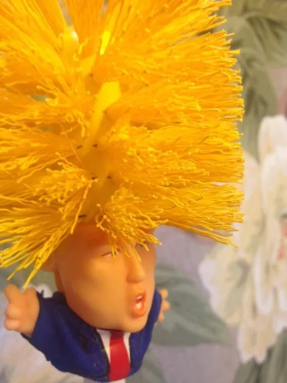 Yellow plastic Donald Trump novelty toilet brush with hanging handle, 40cm long