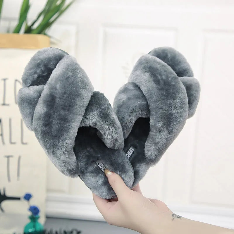 Cross open-toe fur slippers in multiple colours on a patterned non-slip sole.