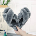 Cross open-toe fur slippers in multiple colours on a patterned non-slip sole.