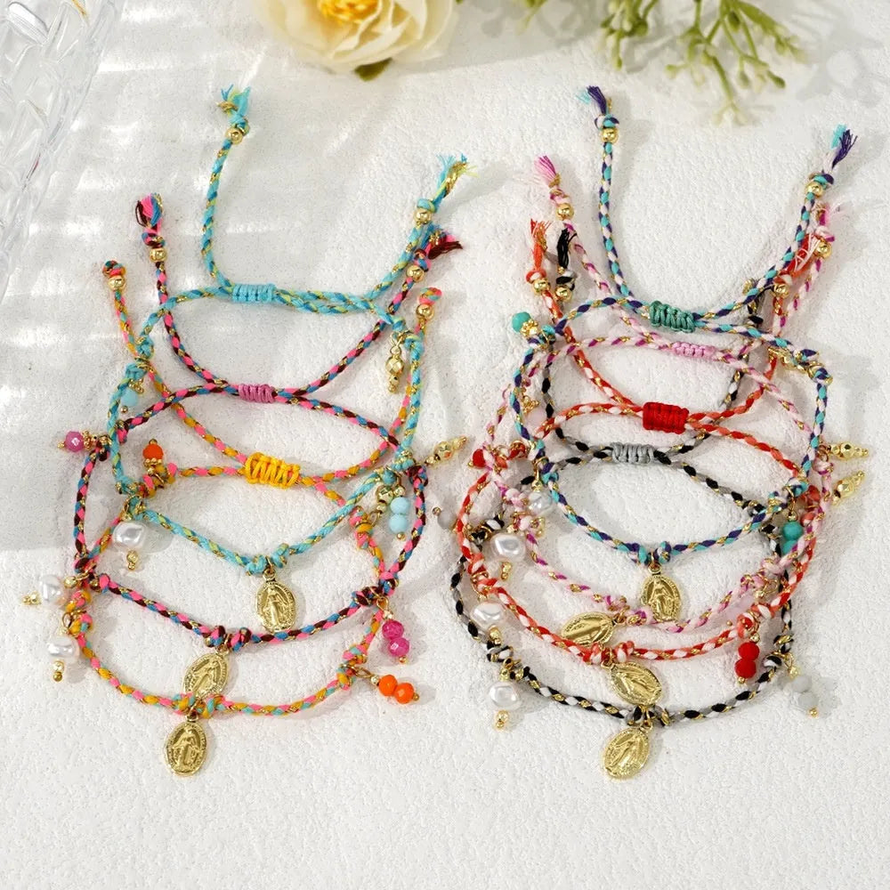 Close-up of a hand-woven ethnic style bracelet for women made from colourful braided rope, showing the strap tag detail.