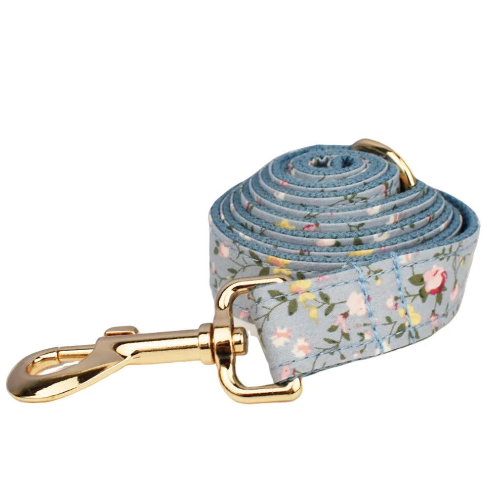 Blue floral dog accessory set with collar, leash, vest, bow tie and poop bag holder
