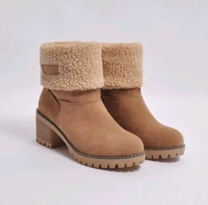 Women's black suede mid-tube snow boots with a thick flat heel and round toe on a white background.