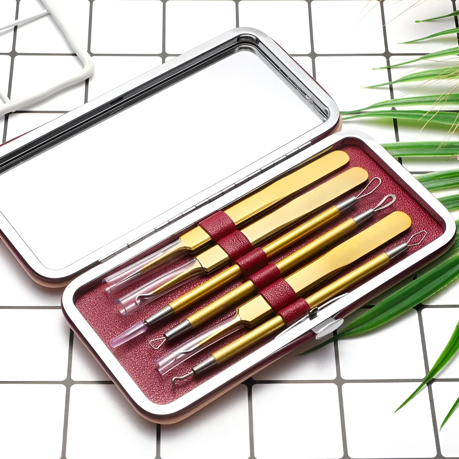 Six-piece stainless steel acne remover beauty tool set in rose gold