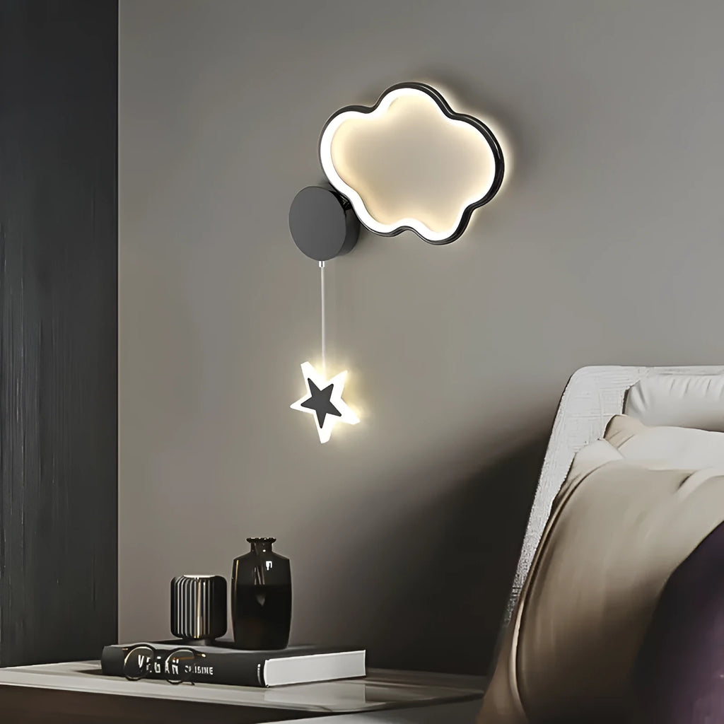 White left-facing cloud children's bedside wall lamp with a three-colour LED light on a bedroom wall.
