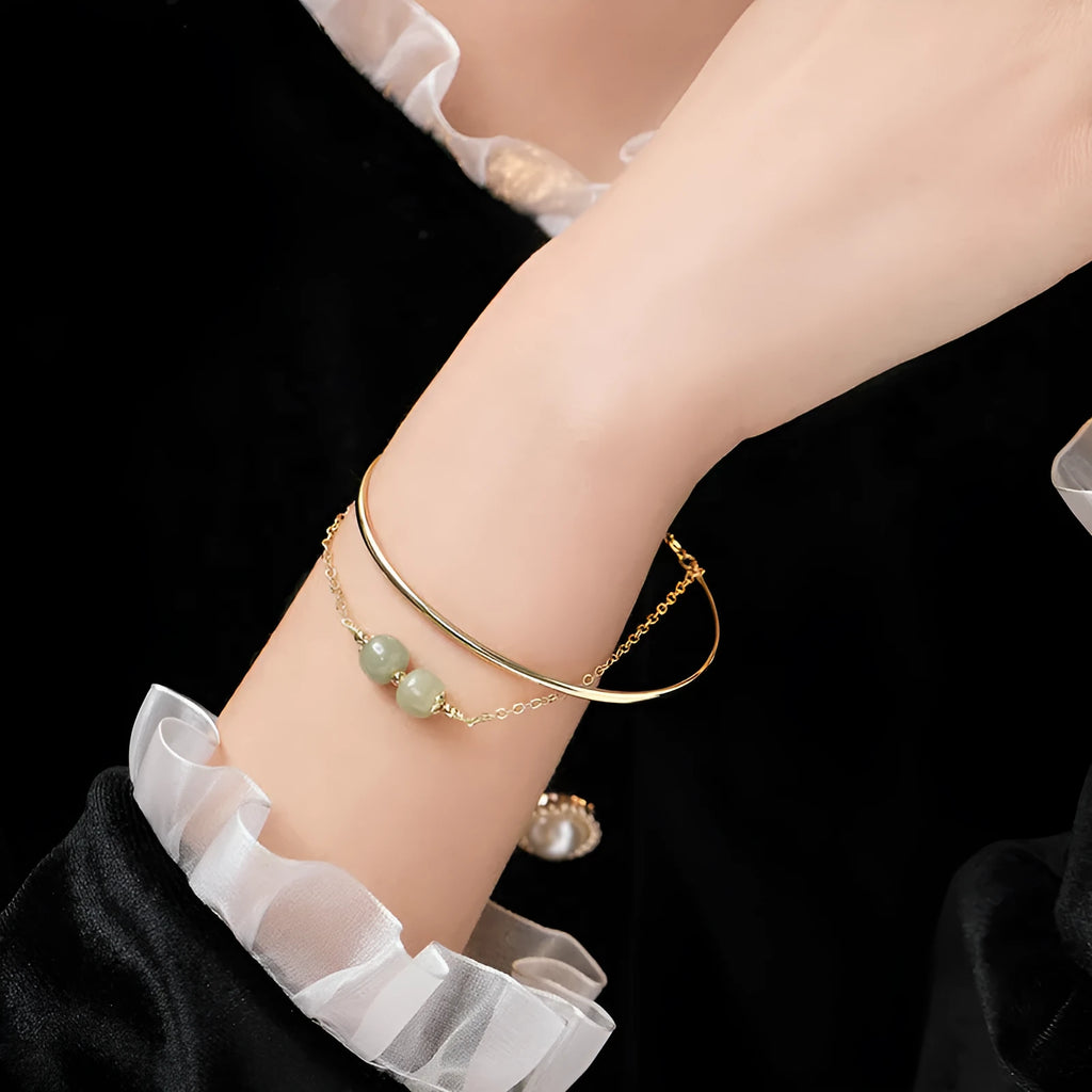 Women's Hetian jade lucky beads bracelet with gold inlay, shown in single, double, and three bead versions.