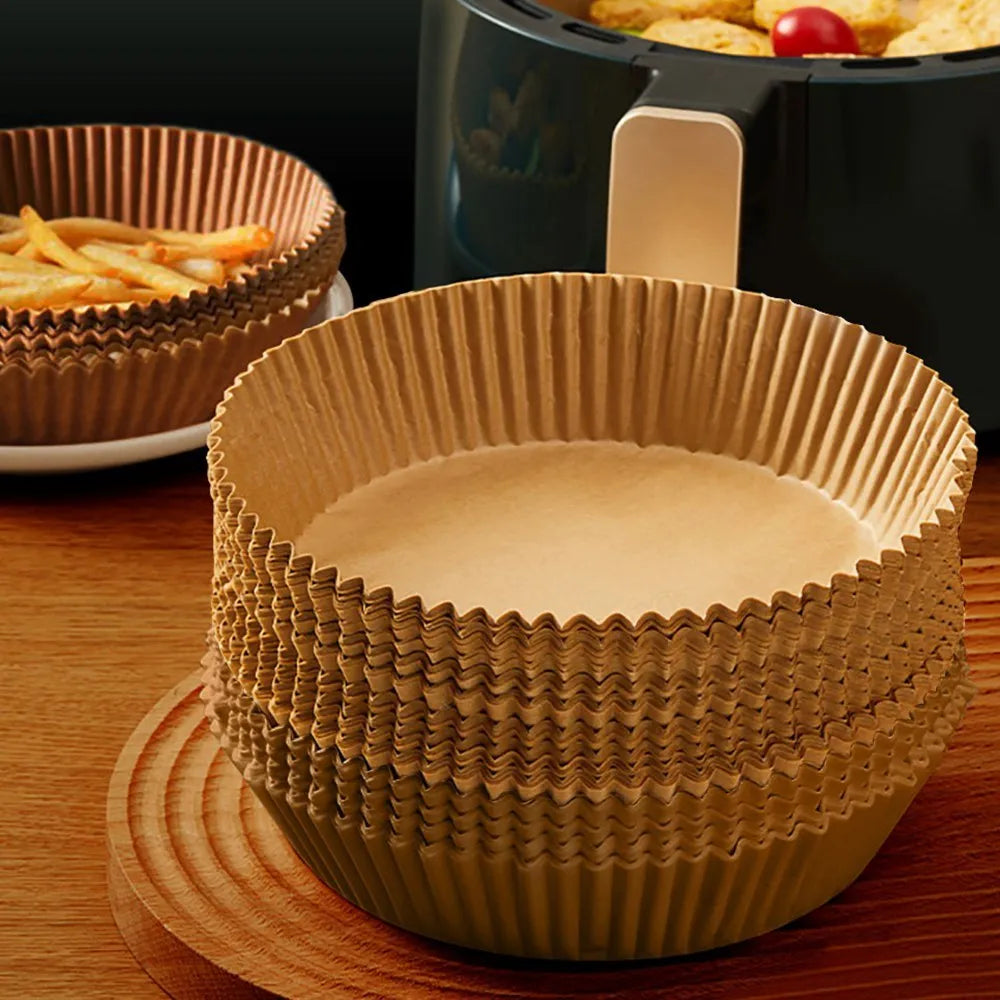 Round disposable paper liners for air fryers with 4.5cm high edges in white parchment colour
