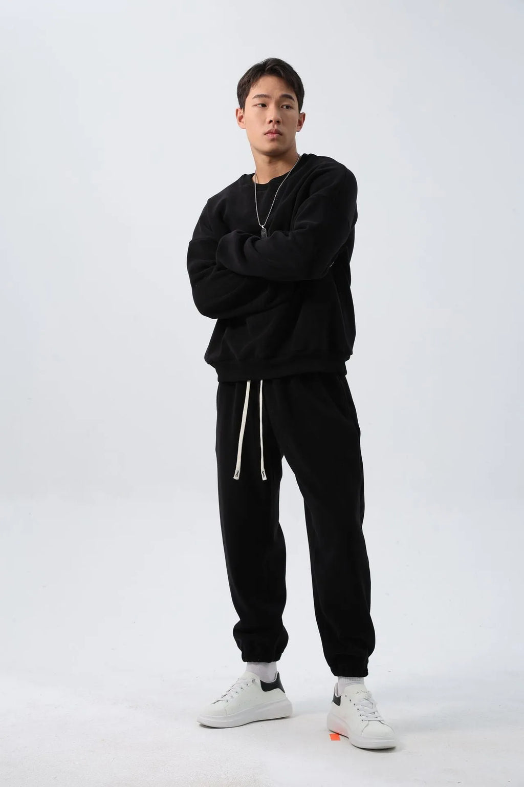 Men's polar fleece sports suit showing long-sleeved top and padded trousers in light grey colour