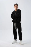 Men's polar fleece sports suit showing long-sleeved top and padded trousers in light grey colour