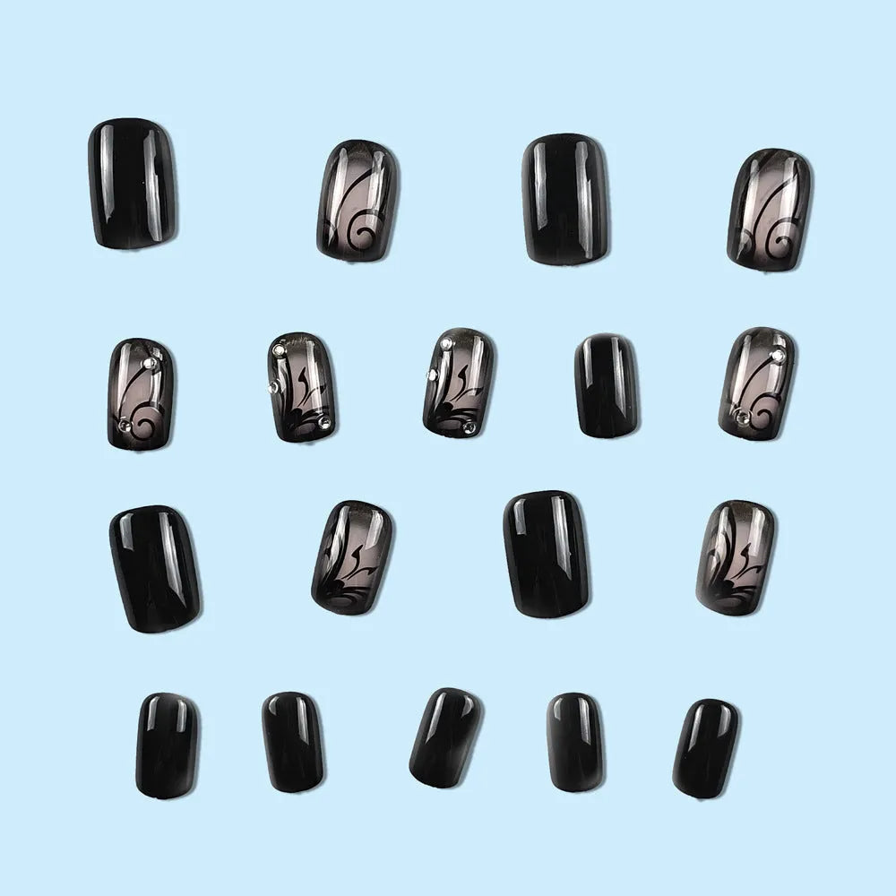 Dark Ins style black vine wearable nail tips set with jelly glue finish on a white background