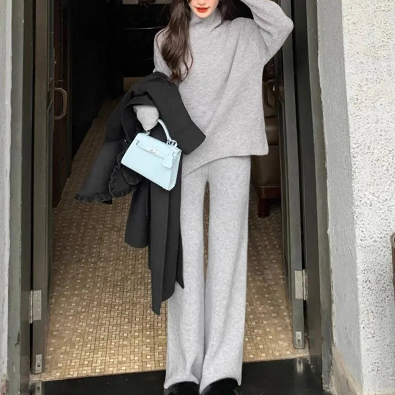 Women's casual two-piece set featuring a long-sleeve sweater and wide-leg trousers in a solid colour.