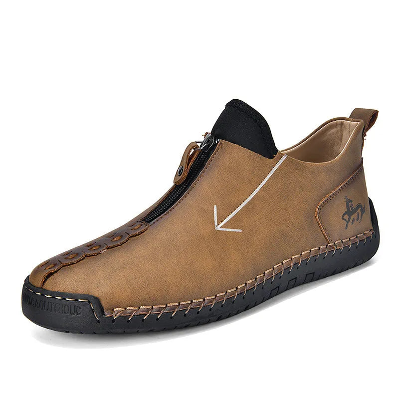 Men's black leather ankle boots with front zipper and round toe on rubber sole