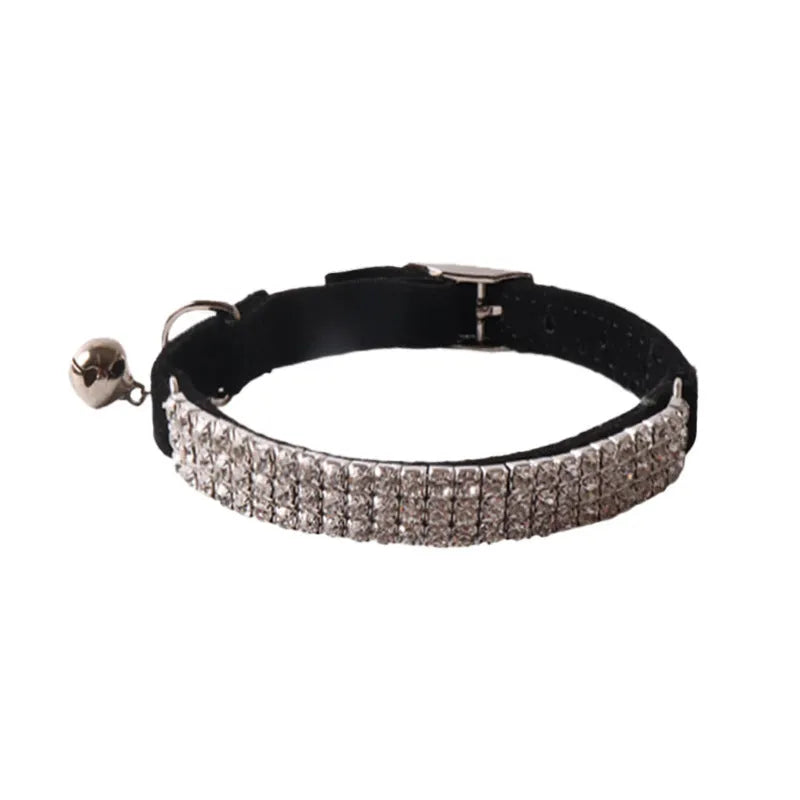 Soft flocked cat collar with elastic buckle in various colours on a white background.