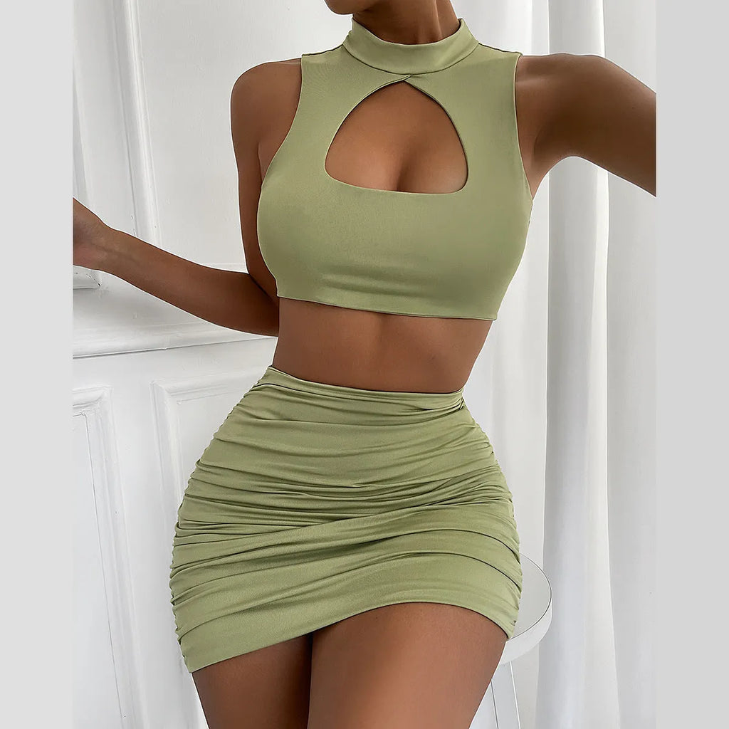 Light purple women's two-piece set with hollow vest and split hip skirt