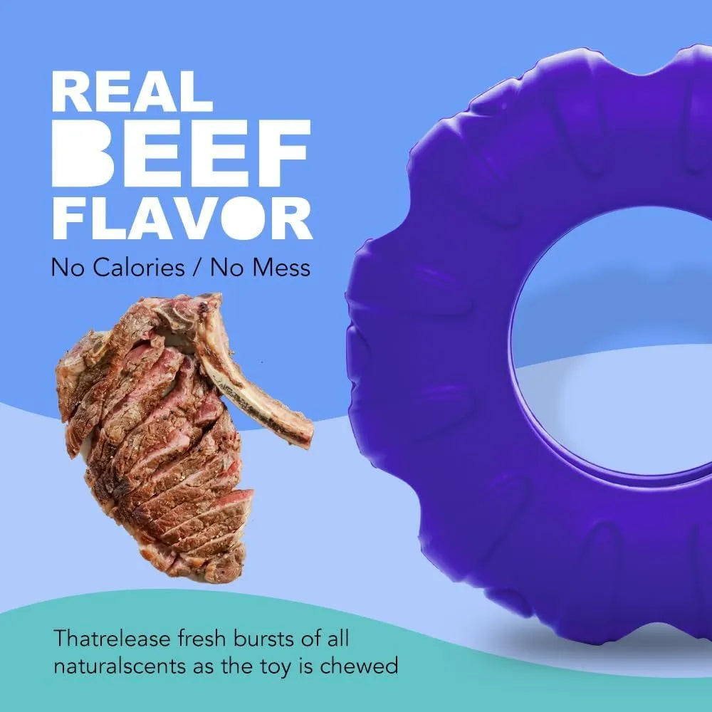 Blue natural rubber tyre-shaped dog chew toy with oval openings for treat dispensing