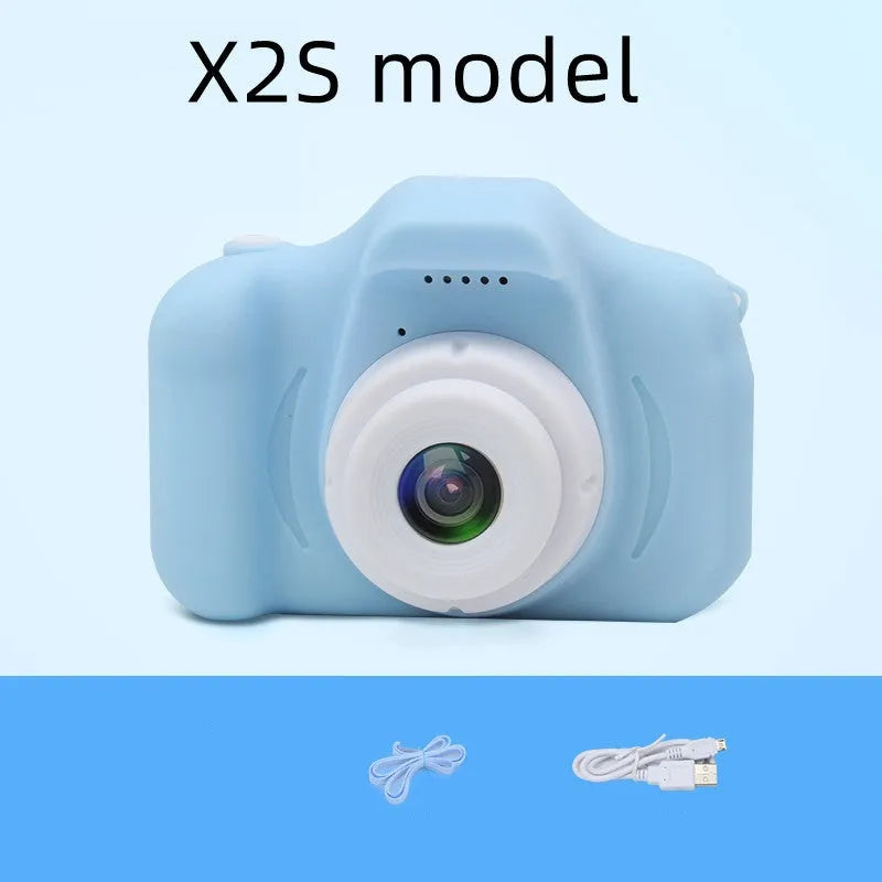 X2 HD mini cartoon kids digital camera in silicone body with 2-inch screen and lanyard.