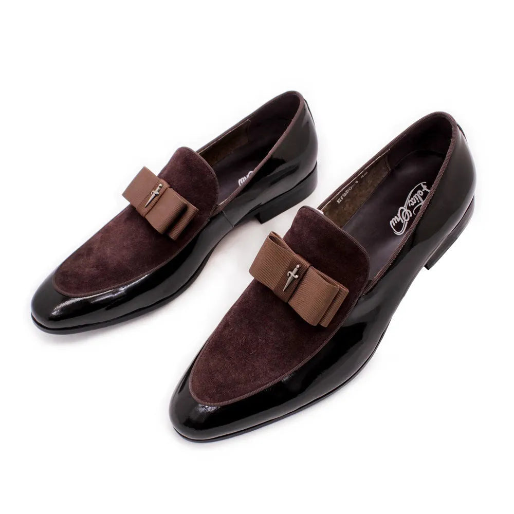 Men's black patent leather low-top dress shoes with a tassel detail on a rubber sole.