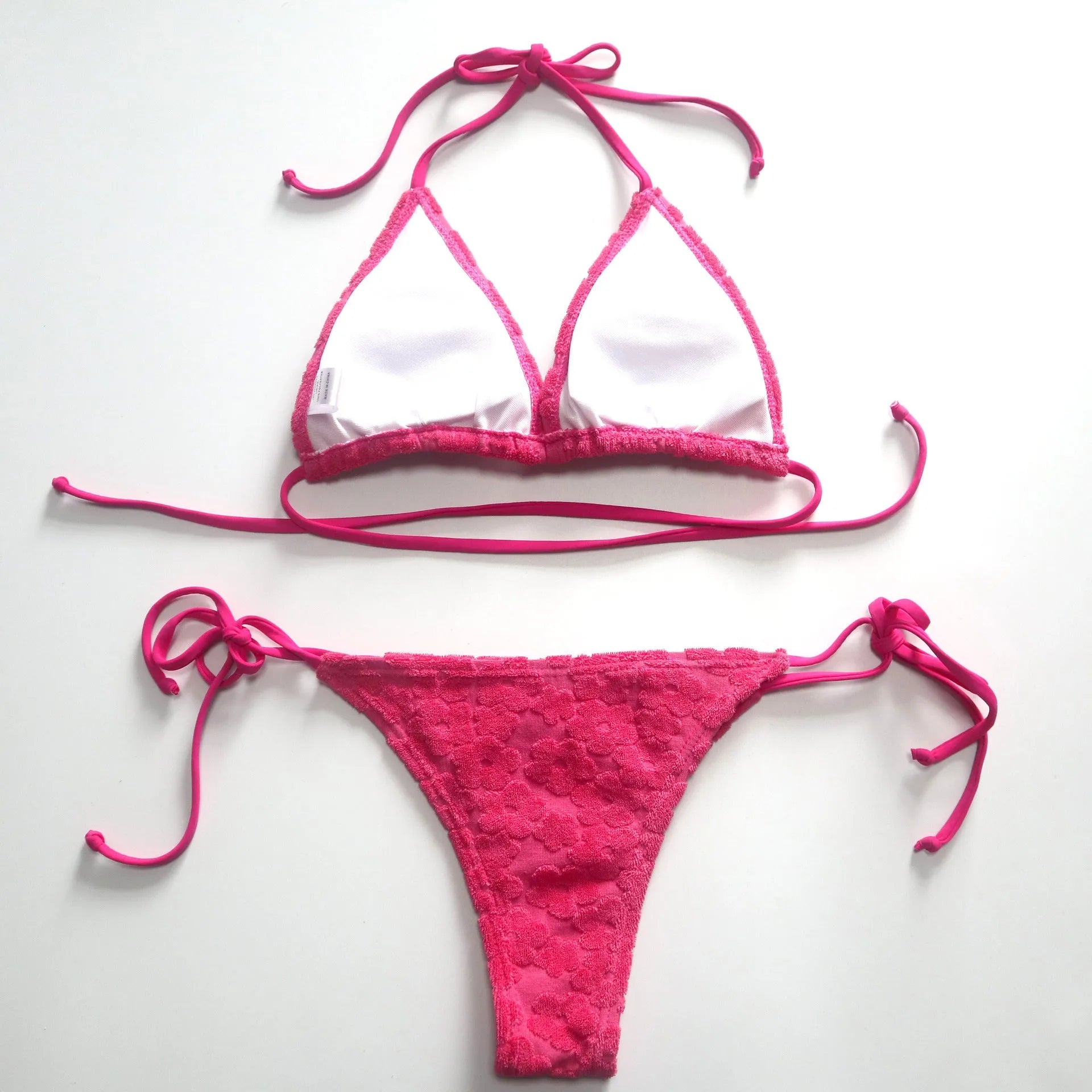 Women's lace-up bikini swimsuit in blue colour on a mannequin