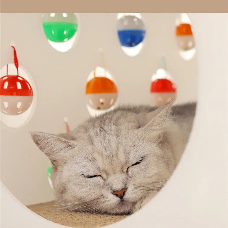 Plastic house-shaped cat scratch board integrated with a cat nest, tunnel, and bell ball toy.