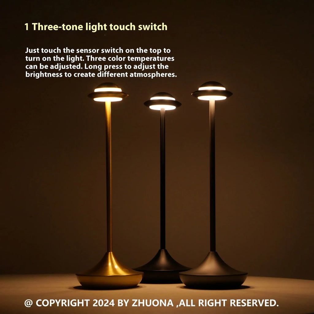 Modern metal UFO-shaped table lamp in black, gold, or grey with touch-sensitive dimming controls.