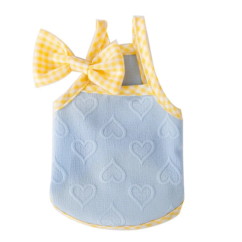 Small dog wearing heart texture bow suspenders vest in Bondi Blue colour
