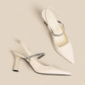 Women's black stiletto high heel sandals with a closed pointed toe and a single buckle strap across the foot.