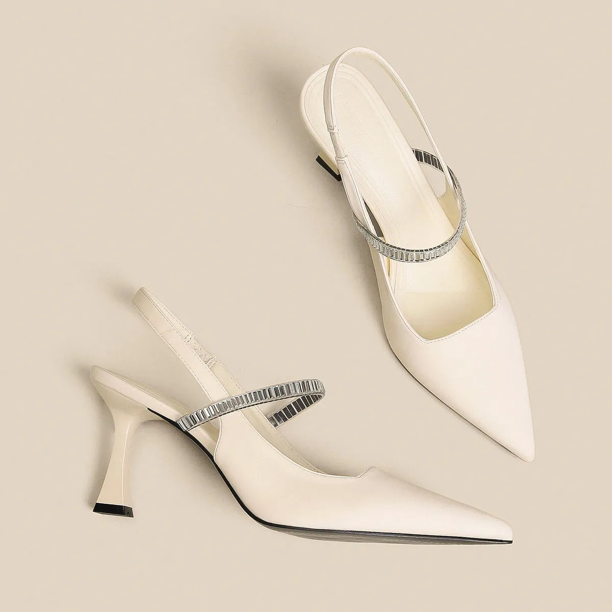 Women's black stiletto high heel sandals with a closed pointed toe and a single buckle strap across the foot.