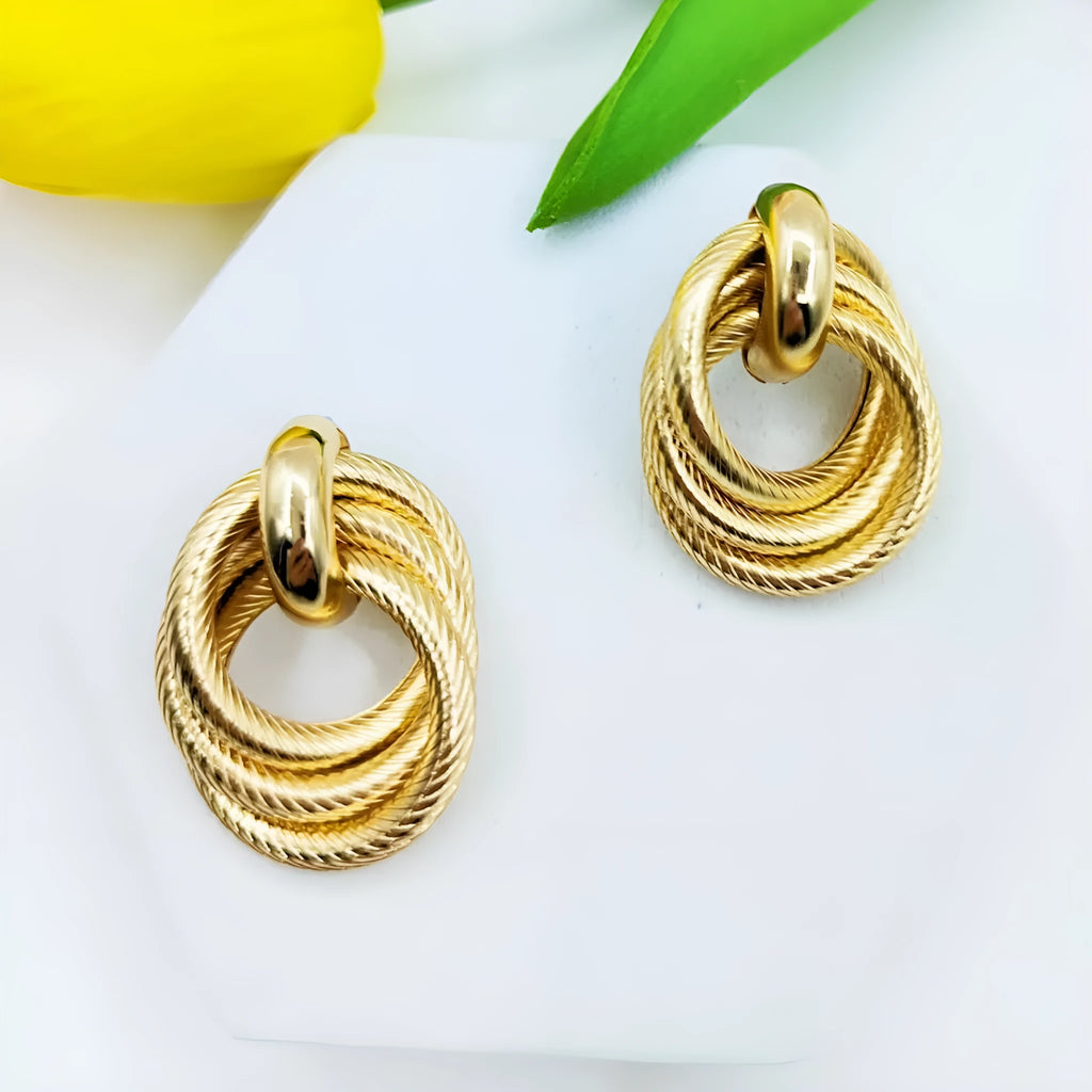 Gold geometric ring embossed twisted stud earrings with exaggerated creative design on metal