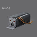 Black portable power bank with digital display, solar panel, and 220V AC outlets for outdoor use.