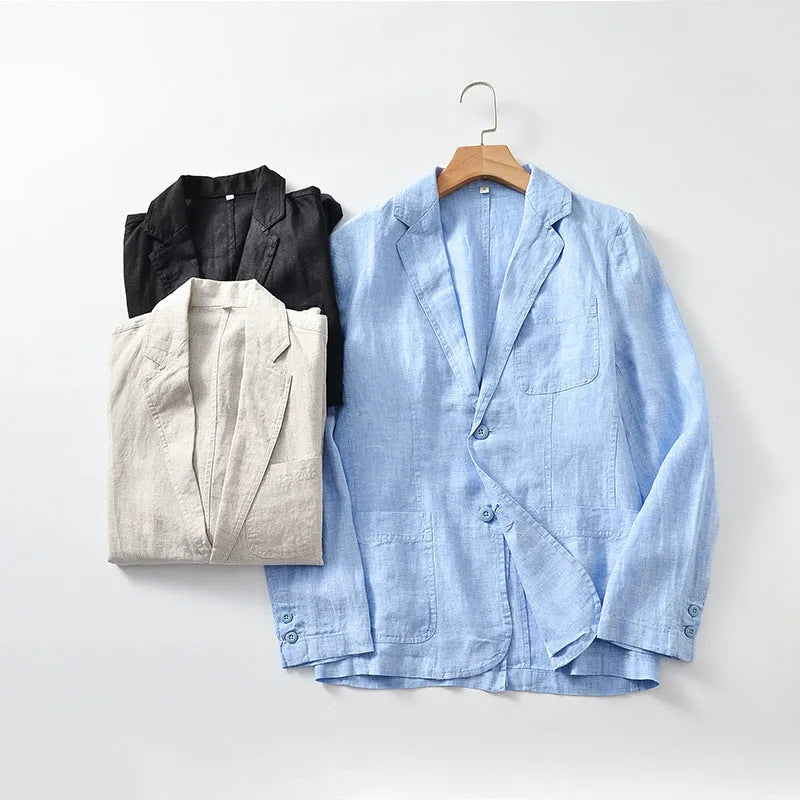 Men's thin linen suit coat in a solid colour on a hanger, showing stick pocket detail.