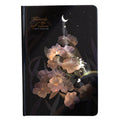 A5 notebook with a luminous blue cover, open to show white paper and a colour illustration page.