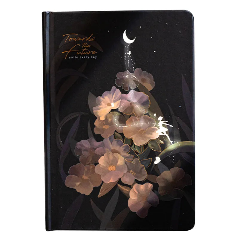 A5 notebook with a luminous blue cover, open to show white paper and a colour illustration page.