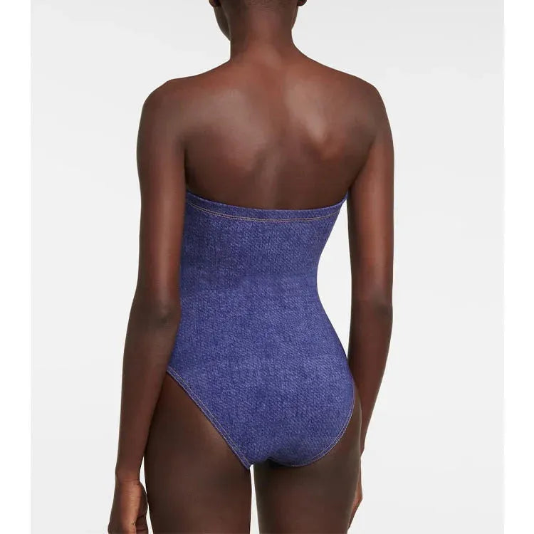 Women's vintage denim-colour one-piece swimsuit with a matching skirt laid flat.