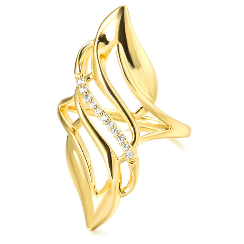 Gold-coloured copper women's ring with exaggerated curve design on finger