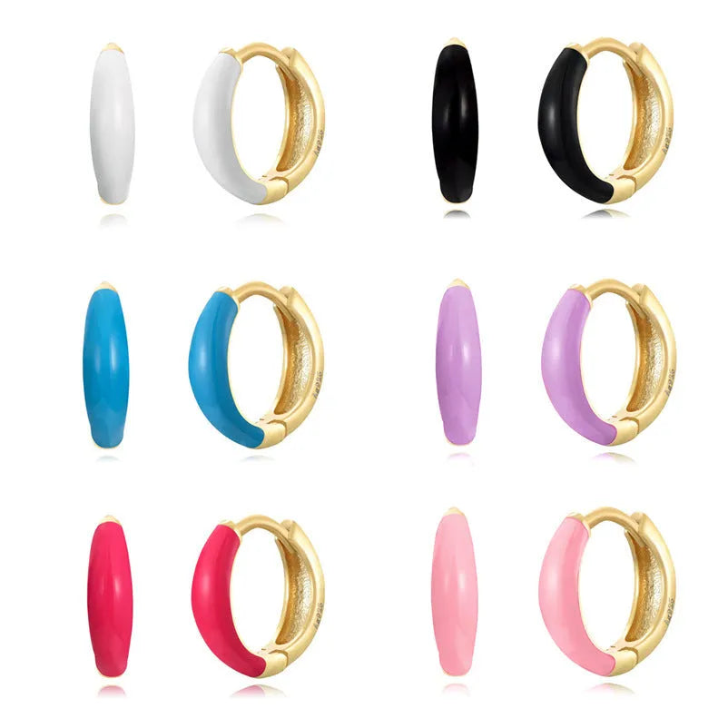 A pair of curved U-shaped oval ring stud earrings with a smooth epoxy resin finish in a selected colour.