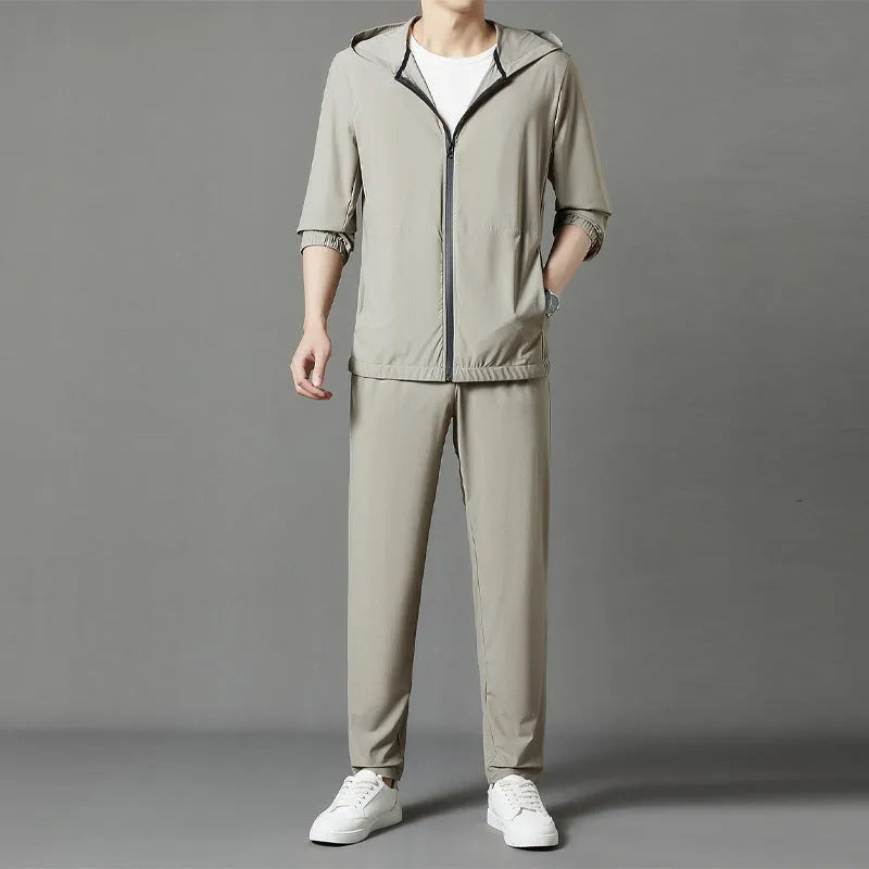 Korean style loose hooded sun-protective suit in grey, blue, or black, featuring top stitching pockets.