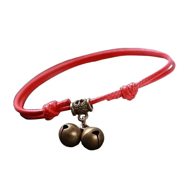 Nylon rope dog collar with brass buckle shown in black, red, and coffee colours, some with an attached brass bell.