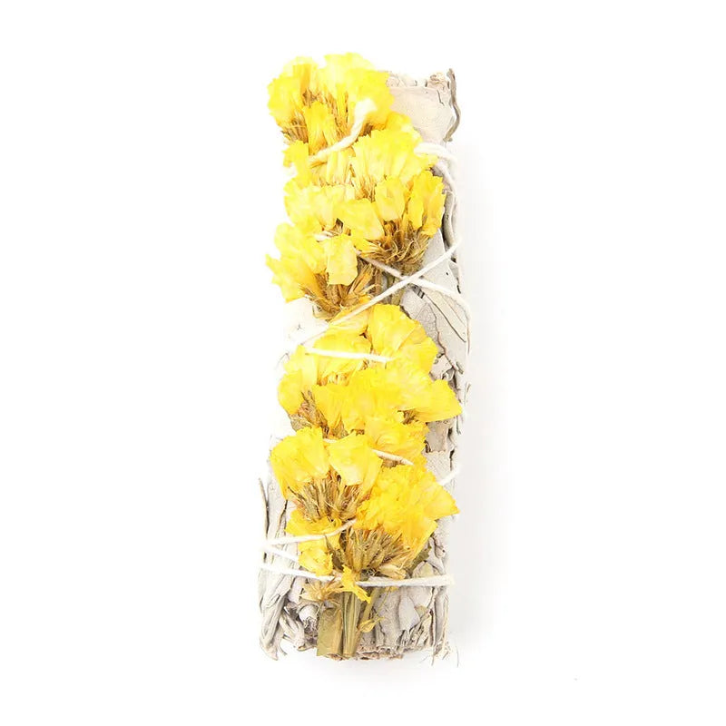 White sage and red rose petal colourful aromatherapy incense bundle on a wooden table
