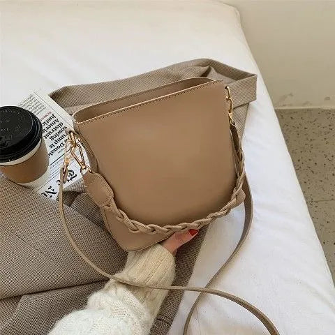 Khaki unisex PU crossbody bucket bag with woven texture and shoulder strap
