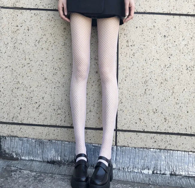 Women's mesh stockings showing large, medium and small hole patterns in black and white colours