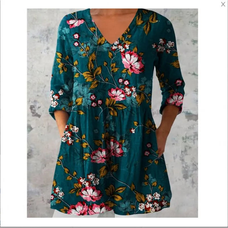 Women's loose floral print dress with wide waist and 3/4 length wave-pattern sleeves.