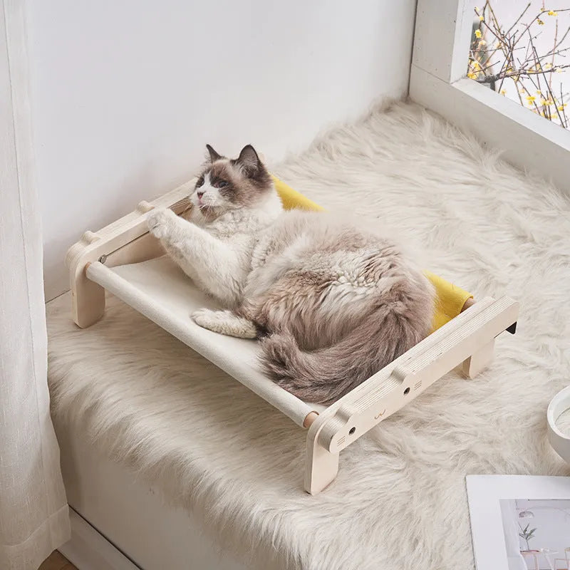 Solid wooden cat bed with removable fabric cover in selected colour option