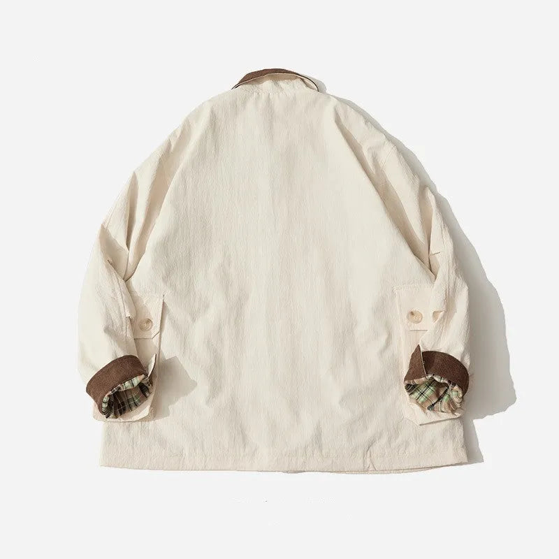 Green casual polyester jacket with side seam pockets on a hanger
