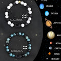 Set of two natural stone beaded bracelets featuring zodiac sign charms on an adjustable cord.