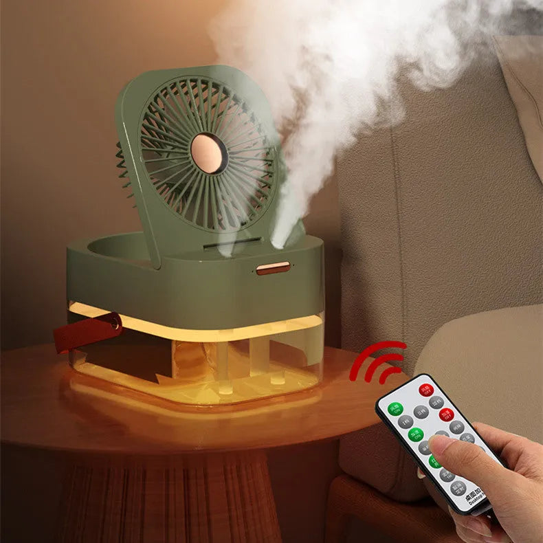 White desktop mist fan with humidifier tank and remote control on a wooden desk.