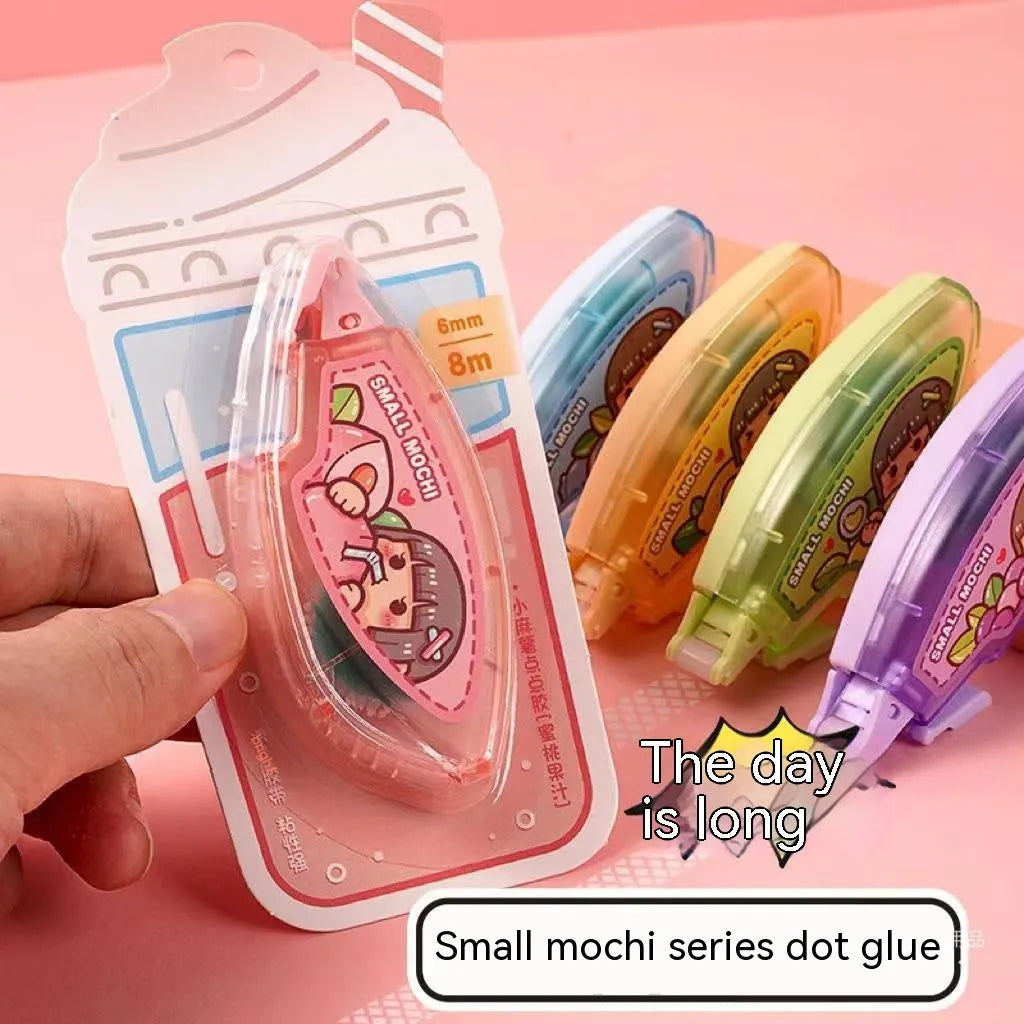 Dotting glue stationery adhesive in assorted fruit juice colours on a card pack.