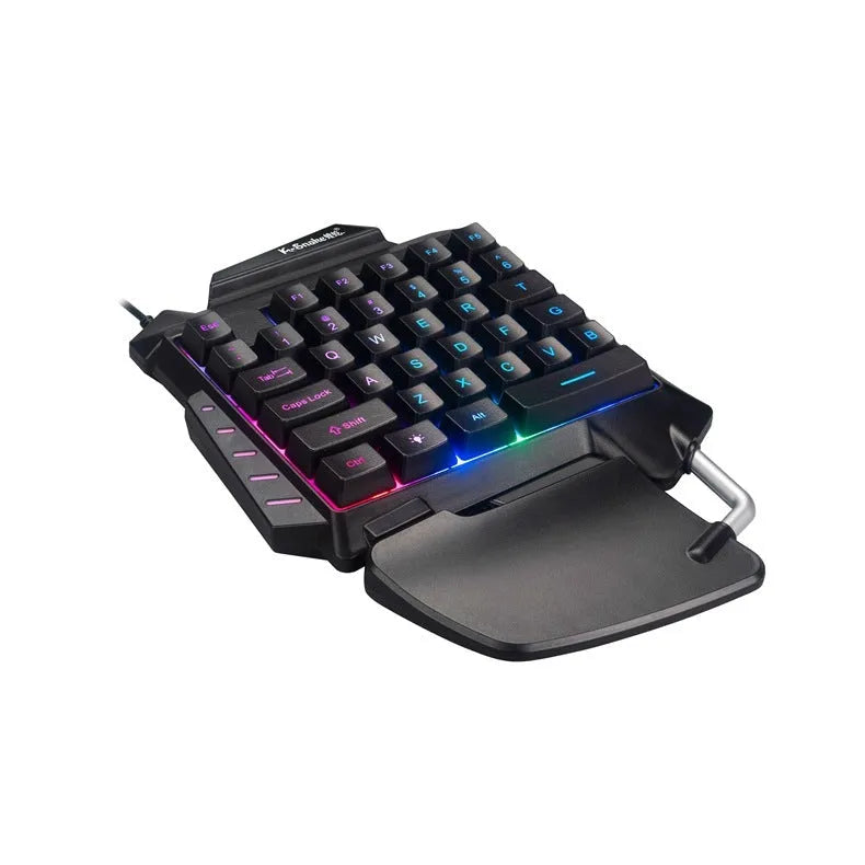 Black one-handed left-hand gaming keyboard with hand rest for desktop throne converter setup.