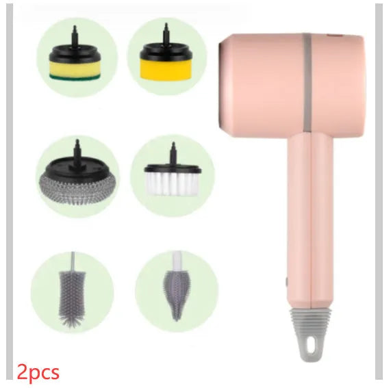 White rechargeable electric cleaning brush with multiple scrubber heads on a kitchen worktop.