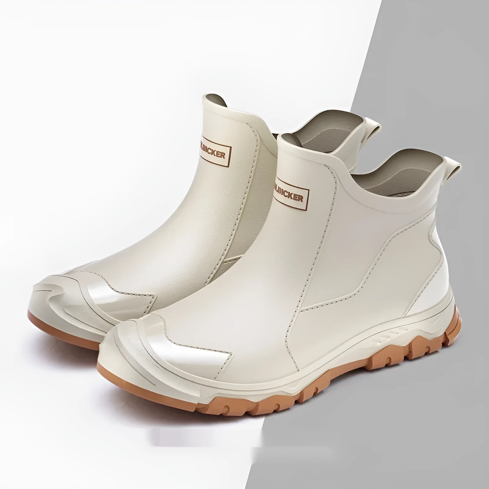 Short tube PVC rain boot in black and red with round toe and flat non-slip sole.
