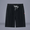 Cotton linen cropped casual pants with drawstring waist in solid Army Green colour on a hanger.