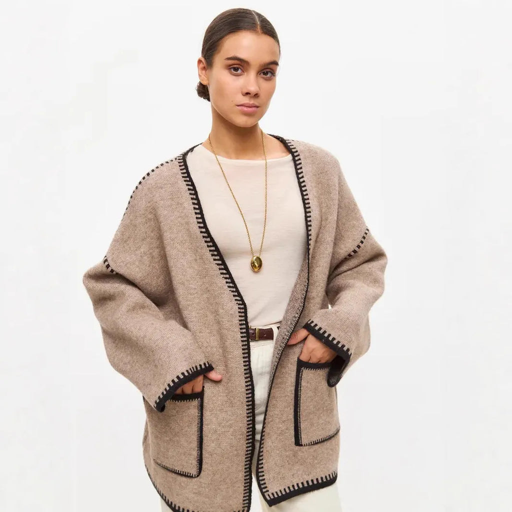 Loose fit knitted cardigan coat in imitation cashmere fabric showing front cardigan styling and long sleeves